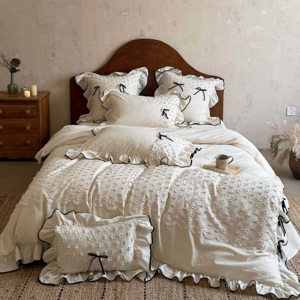 Romantic cotton-linen bed linen set with broderie anglaise, frills, and contrast piping