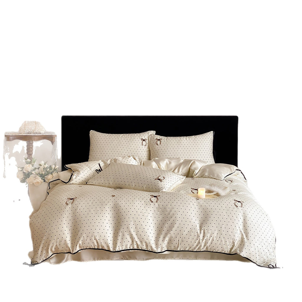 Luxurious satin bedding set with delicate polka dots and bow embroidery