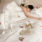 Romantic satin bedding set with strawberry embroidery and ruffles
