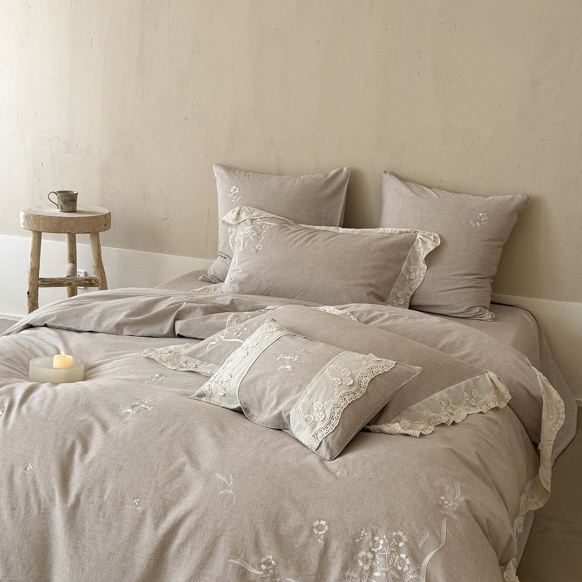 Vintage-inspired linen-cotton blend bedding set with floral chain stitch embroidery and lace trim