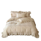 Vintage-inspired cotton bedding set with ruffles, delicate floral embroidery, and lace trim