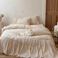 Country house style complete bedding set with voluminous bed skirt, lace trim, and fine floral embroidery